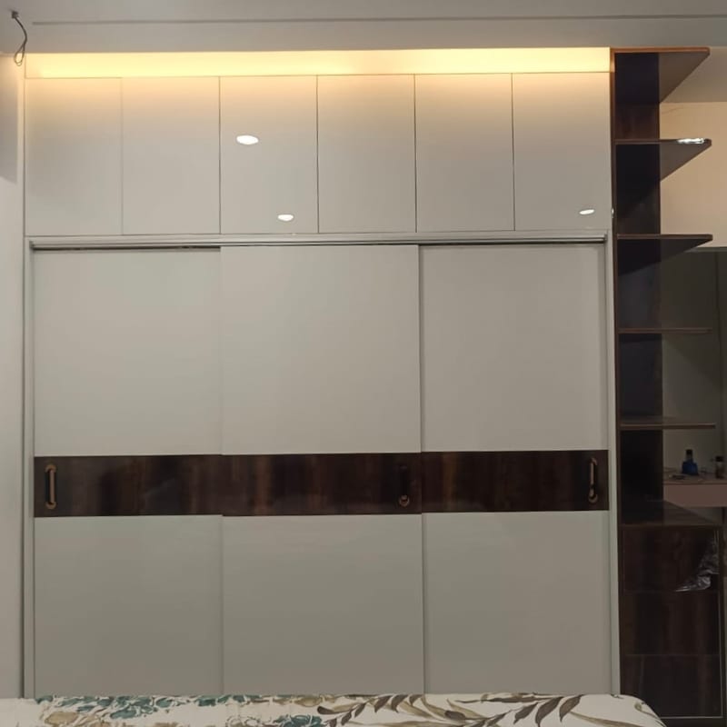 The sliding wardrobe as built, the dark band and display column in the same positions, with top boxes taken to the ceiling